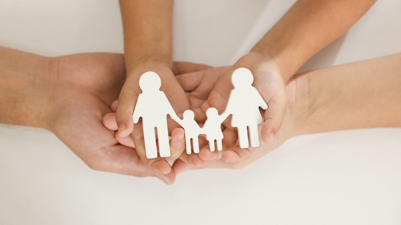 Parents and child with figures of family on white background, top view